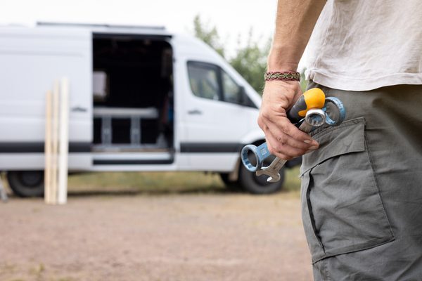 A man holding workman's tools to support myth busting around what an enforcement agent can and cannot do.